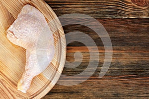 Chicken leg on a cutting board