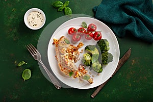 chicken legs backed with feta cheese tomatoes and broccoli, healthy keto meal