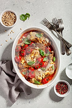 Chicken legs backed with feta cheese tomatoes and pine nuts, healthy meal
