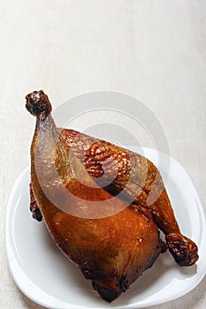 Chicken legs, cooked on a grill on a white background. Copy space. Vertical