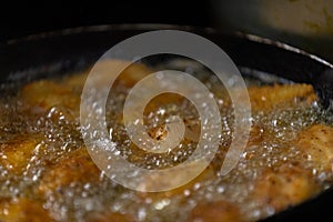 Chicken legs cooking in adobo sauce