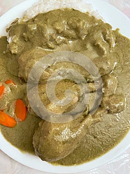 Chicken Legs in Green Mole Sauce with White Rice and Carrots