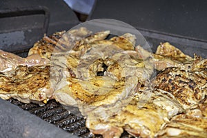 Chicken legs on a hot grill, close up texture