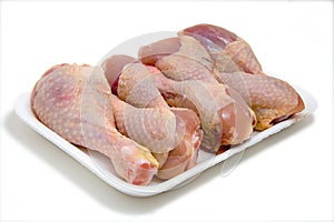 Chicken legs on plastic plate