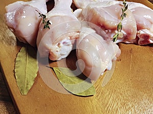 Chicken legs raw broiler closeup herb