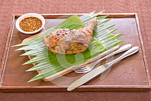 Chicken legs served on wood plate