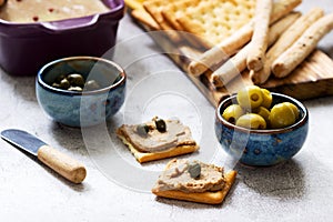Chicken liver, onion and carrot paste, served with crackers, grissini, olives, capers and champagne