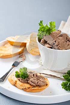 Chicken liver pate on bread and in bawl