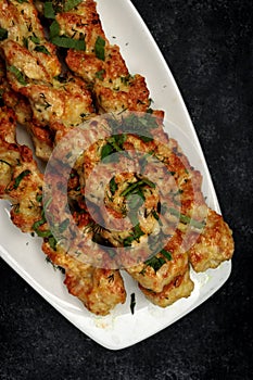 Chicken lulia kebab with herbs on a plate photo