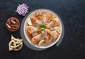 Chicken Mandi with dates. Arabic cuisine. Top view photo