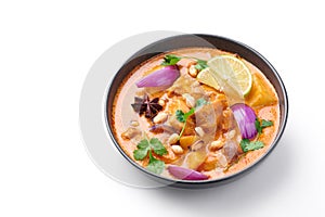 Chicken Massaman Curry in black bowl isoated on white background. Massaman Curry is Thai Cuisine dish Thai Food. Isolate