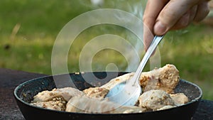 Chicken meat in a frying pan