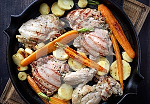 Chicken meat and roasted vegetables on cooking pan