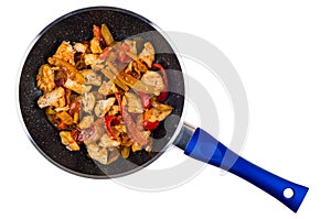 Chicken meat with sweet pepper in frying pan on white