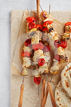 Chicken and mushroom skewers with fresh vegetables. Shish kebab