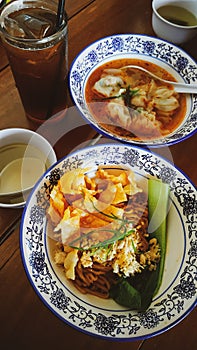 chicken noodles, dumpling soup and iced tea