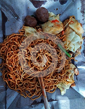 Chicken noodles with meatball and pun ksitu form indonesian street food