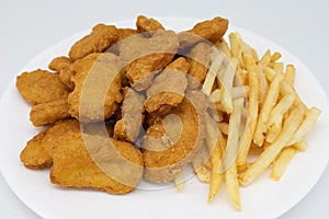 Chicken Nuggets and French Fries on a White Plate with a White Background