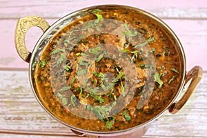 Chicken Palak Korma Masala Gravy served in karahi isolated on table closeup top view of indian spices food