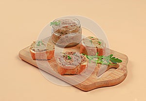 Chicken pate with homemade whole grain bread and herbs on a light table, the concept of a healthy lifestyle and natural nutrition