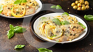 Chicken Piccata with capers, white wine sauce and spaghetti. Italian food