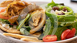 Chicken pita giro and Greek salad. Healthy eating mages. photo