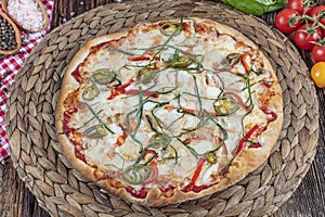 Chicken Pizza. Pizza with chicken and vegetables on wooden background