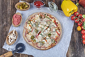 Chicken Pizza. Pizza with chicken and vegetables on wooden background