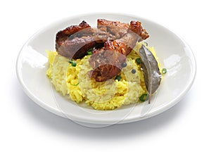 Chicken and pork adobo over yellow rice, filipino food photo