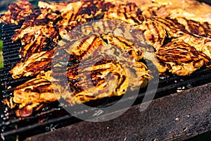 Chicken and pork steak grilled on a charcoal barbeque. Top view of camping tasty barbecue  food concept  food on grill and detail
