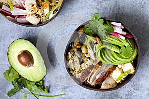 Chicken, quinoa and avocado in coconut bowl