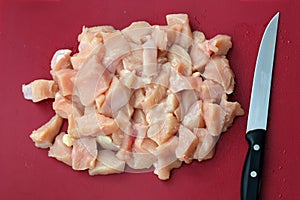 Chicken raw meat cut into pieces top view.