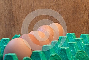 Chicken red eggs in a row, close-up