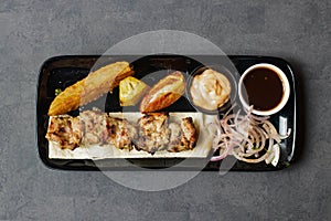 Chicken Reshmi tikka boti Kabab with chili sauce, dip and onion served in dish isolated on table top view of asian and indian food