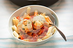 Chicken and ricotta meatballs in tomato sauce with pasta