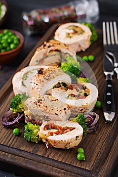 Chicken roll with stuffed sun-dried tomatoes and cheese.