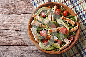 Chicken salad with avocado, arugula and tomatoes. horizontal top