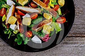 Chicken salad with cherry tomatoes and lettuce food healthy meal close up