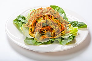 Chicken salad with fresh vegetables and sesame in Asian style