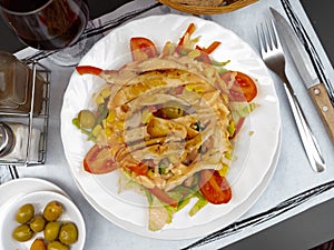 Chicken salad with lettuce, tomato and olives photo