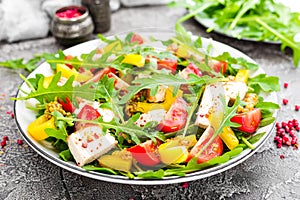 Chicken salad. Meat salad with fresh tomato, sweet pepper, arugula and grilled chicken breast. Chicken fillet with fresh vegetable