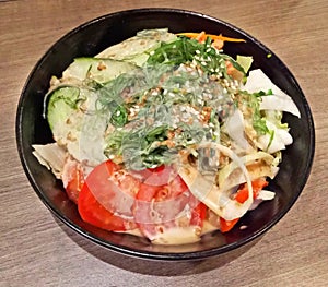 Chicken Salad served with tomatoes, seaweed, cucumber and mentai sauce