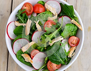 Chicken salad with turnips and rocket leaves