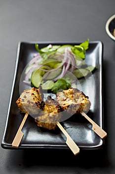 Chicken satay and cucumber salad