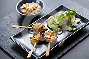 Chicken satay and cucumber salad