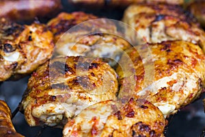 Chicken Sausages being grilled on an outdoor barbecue for that S