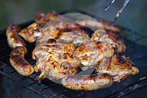 Chicken Sausages being grilled on an outdoor barbecue for that S