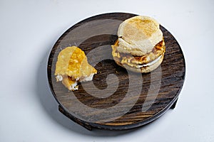 Chicken saussage mcmuffin with egg, and golden brown and crispy, hashbrowns photo
