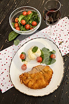 Chicken schnitzel served with mashed potatoes