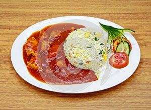 chicken shashlik or chicken manchurian with salad fried rice served in a dish isolated on grey background side view of indian,